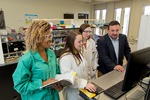 Halamek and students Mindy Hair, Adrianna Mathis and Erica Brunelle.