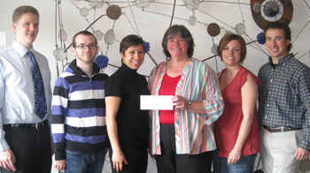 SPH students present check to Equinox.