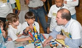 students and families working on Legos projects