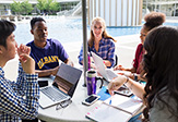Students gather around the main fountain to study and socialize.