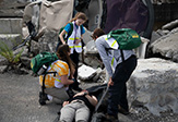 UAlbany students serve as first responders to live role players in a simulated collapsed parking garage. 