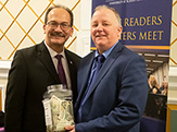 President Rodríguez and New York State Writers Institute Director Paul Grondahl ’84 hold a donation jar that was passed up and down the rows of Page Hall during Monday night’s Hurricane Maria panel discussion. 