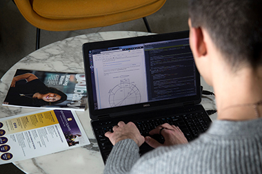 UAlbany senior Aleks Siemenn displays his computer modeling software to simulate the viability of oscillating water column systems as a renewable energy source.