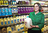 Historian Kendra Smith-Howard holding a gallon of milk