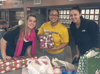 UAlbany's softball team wraps presents for disadvantaged children