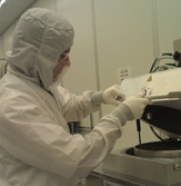 Brian Janiszewski works in UAlbany's clean room.