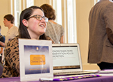 A student explains her work at the University at Albany Undergraduate research conference