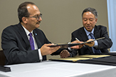 U Albany President  Havidán Rodríguez  and Dr. Zhuo Zhi, president of Southwestern University of Finance and Economics, sign the MOU. 