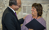 President Rodríguez and School of Education secretary Deb Brown smile broadly