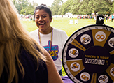 A young UAlbany student asks 'where's your purple?' at LatinFest