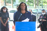 NYS Attorney General Letitia James speaks at an outdoor dias