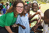 UAlbany Peace Corps volunteer in Kenya with children. 