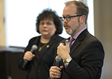 Vice Provost Jeanette Altarriba and Interim Education Dean Jason Lane hold microphones adressing a crowd