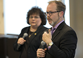 Vice Provost Jeanette Altarriba and Interim Education Dean Jason Lane hold microphones adressing a crowd