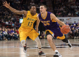 Joe Cremo of UAlbany dribbles past a Siena defender
