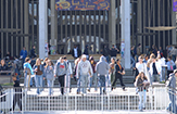 UAlbany students swarm out of the Campus Center toward the Main Fountain.