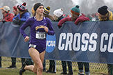Hannah Reinhardt runs past the NCAA Cross Country Championship banner on Nov. 16