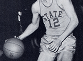 Close-up of a 1958 State College basketball jersey, in action.