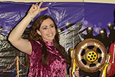 A female UAlbany World Video award winner waves to the crowd