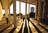 Students walking across UAlbany's academic podium