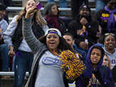A Great Danes fan cheers from the stands during UAlbany's 2018 Homecoming football game.