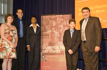 Student leaders and UAlbany administrators with Stuart Milk and new poster of alumnus Harvey Milk.