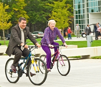 SUNY Chancellor Nancy Zimpher and UAlbany President George Philip take a bike ride on campus to promote sustainability.