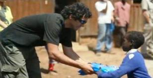 UAlbany MBA student Danny Bocanegra handing out mosquito nets in Africa