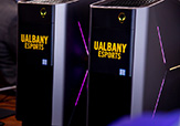 Photo of UAlbany eSports' purple & gold lit computers.