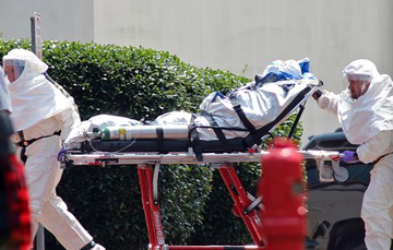 A hospital in Dallas diagnoses Ebola after a man travels from Liberia to visit family