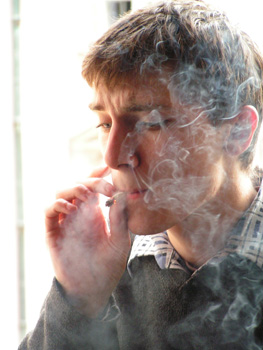 A man smoking a cigarette