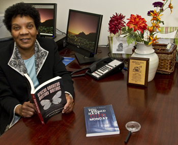 Bailey in her office with two of her books.