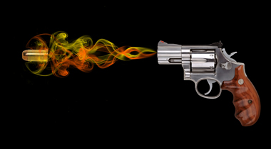 pistol firing a bullet
