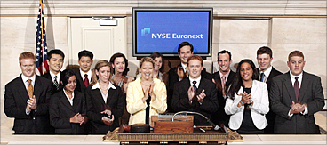 Interns ring the closing bell at the New York Stock Exchange