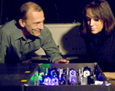 UAlbany Professor Igor Lednev looks over a laser with a forensics student