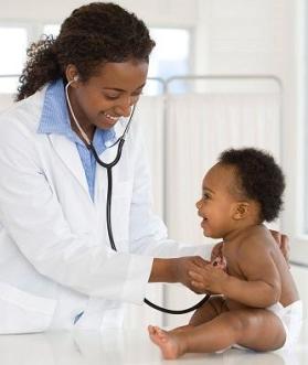 African American Physician listens to baby's heart rate.