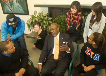 Frank Pogue Jr. with students during an earlier visit to the UAlbany campus.