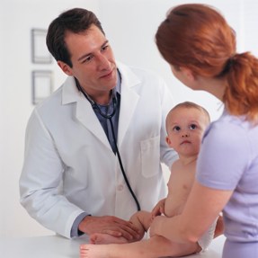 doctor with baby and mother