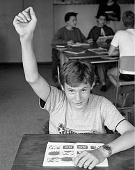 student raising his hand