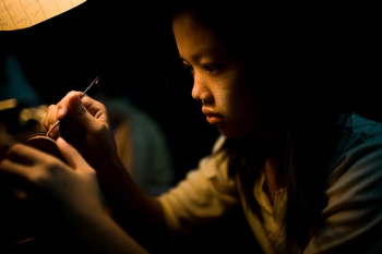Employee making transistors in Myanmar. 