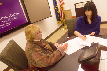 Center for Global Health Director Carol Whittaker plans the conference with Suniah Ayub.