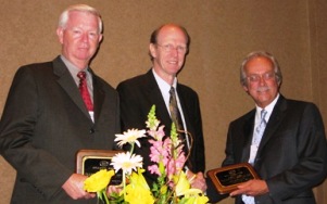 Gregory Lee, Kim Warren, head of the System Dynamics Application Award Committee, and Kenneth Cooper
