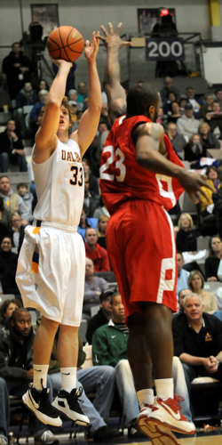 Brian Connelly of UAlbany Men's Basketball team shoots a jumpshot against Stony Brook