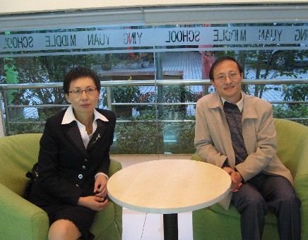 University at Albany Education Professor and Fulbright Scholar David Yun Dai seated with a colleague in China