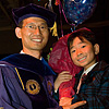 Graduate and family member celbraing after the University at Albany, SUNY 2008 Winter Commencement