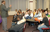 Carson Carr, Jr., associate vice president for academic affairs and director of the Educational Opportunity Program (EOP), discusses college life with Albany High students.