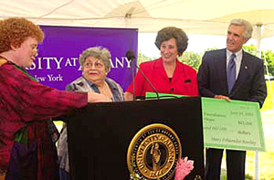 Mrs. Mary Polsinello Hanley, second from left, an Albany resident formerly of Rensselaer, presented a check to Dr. Paulette McCormick, left, President Hitchcock, and Senator Bruno for $65,000 during the groundbreaking ceremony.
