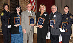 Albany Police Department (APD) Officers Kathleen Rissberger (left) and Karen Mink (far right) received the Public Official Award, Laurie Lieman (2nd from left) received the Neighborhood Award, Thomas Gebhardt (3rd from left) received a plaque from the APD for 15 years of leading the Committee, Julie Byron (3rd from right and Michael Byron's daughter) accepted the Business Award on his behalf, and Reverend Vernon Victorson (2nd from right) received honorable mention in the Neighborhood Award.
