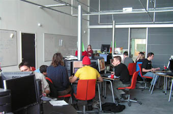 Gamers working on programs and games