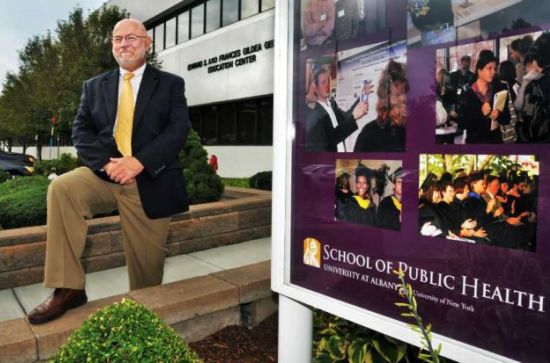 UAlbany School of Public Health Dean Philip C. Nasca in front of the George Education Center